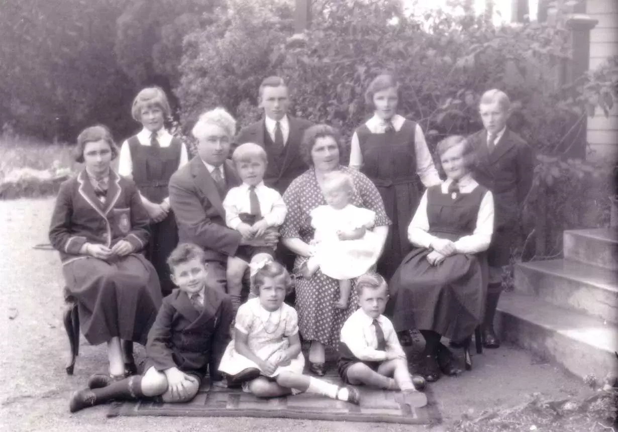 The Lyons family pose for a black and white photo, taken in 1935.  