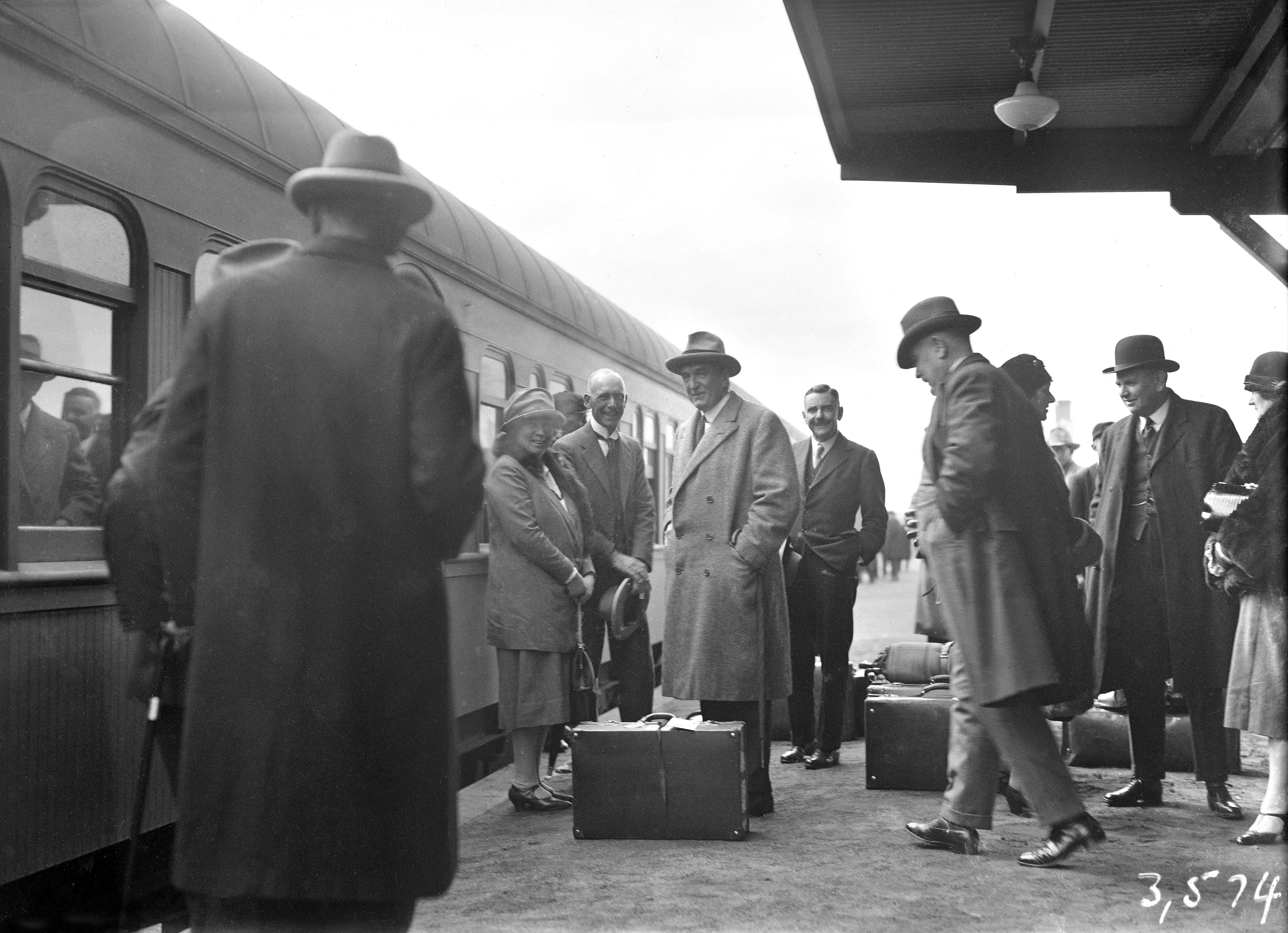 Stanley Bruce on a train platform.  